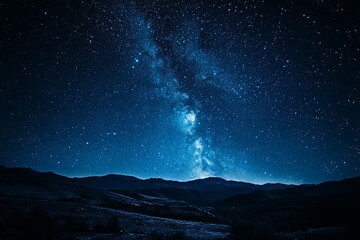 Naklejka premium Starlit night sky over mountains reveals the Milky Way in a remote location, showcasing the beauty of the universe at dusk. Generative AI