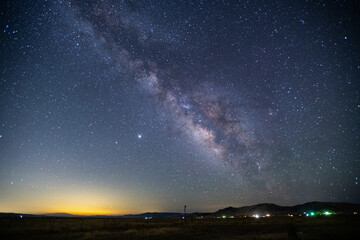 the milky way over a rural prairie community