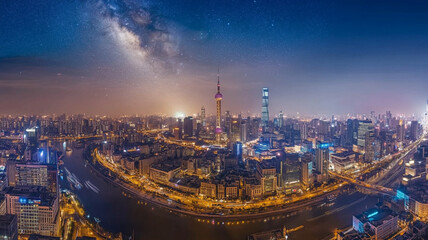 Fototapeta premium Shanghai skyline showing the milky way over the huangpu river at night