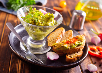 Traditional latinamerican mexican sauce guacamole in bowl