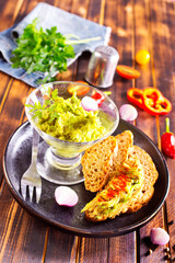 Traditional latinamerican mexican sauce guacamole in bowl
