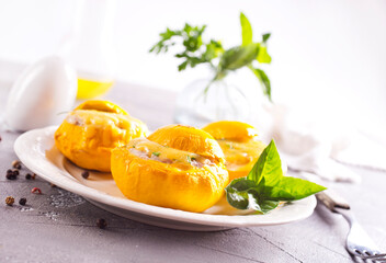 Veggie stuffed round cougretes on white plate