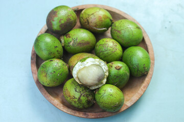 close up of green matoa fruit. Pometia pinnata