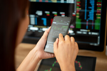 Hands of a woman using smartphone buy cryptocurrency, blockchain investment, decentralize and Stock market concept