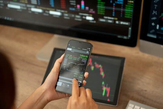 Hands of a woman using smartphone buy cryptocurrency, blockchain investment, decentralize and Stock market concept