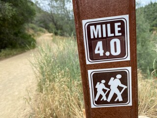 Hiking trail mile marker in the outdoors.