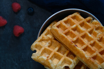 Belgian waffles on a dark background