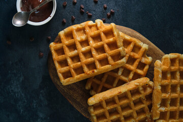 Belgian waffles on a dark background