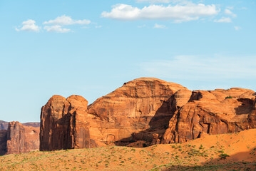 Fototapeta premium Sunlit sandstone rock formations in Monument Valley