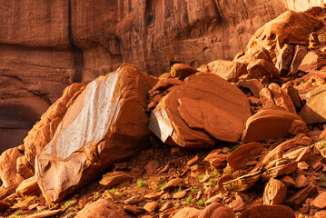 Close-up of large red boulders and sandstone Mesa in Monument Valley.