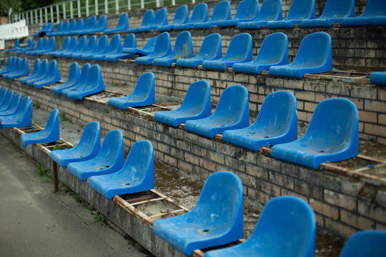 Sports stand. Empty seats in the stadium. Chairs in the stadium.