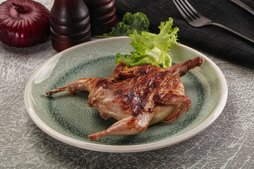 Grilled quail in the plate