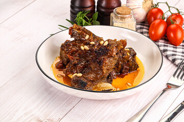 Prepared tasty beef ribs with sauce