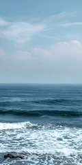 Store enrouleur  Blue Sky and Ocean Waves Crashing on the Shore  © Adobe Contributor