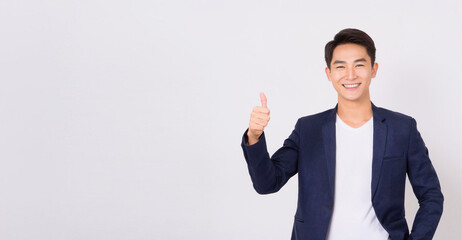 A portrait of an Asian male businessman giving a thumbs up with a smile.