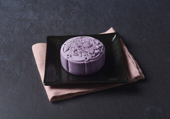 premium yam taro purple pink cute healthy baked lotus paste mooncake with layer egg yolk and mochi rose flower 3d shape in black table lantern pastry autumn festival halal asian dessert food menu cafe