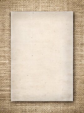 Sheet of paper on burlap texture background. Template for creative design