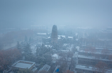 Aerial photography of snow scenery at the Little Wild Goose Pagoda in Xi'an, China