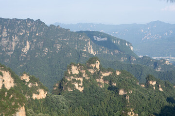 Fototapeta premium Misty rock pillars and mountain landscape in Zhangjiajie, Hunan Province, China
