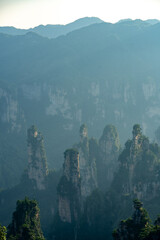 Fototapeta premium Misty rock pillars and mountain landscape in Zhangjiajie, Hunan Province, China