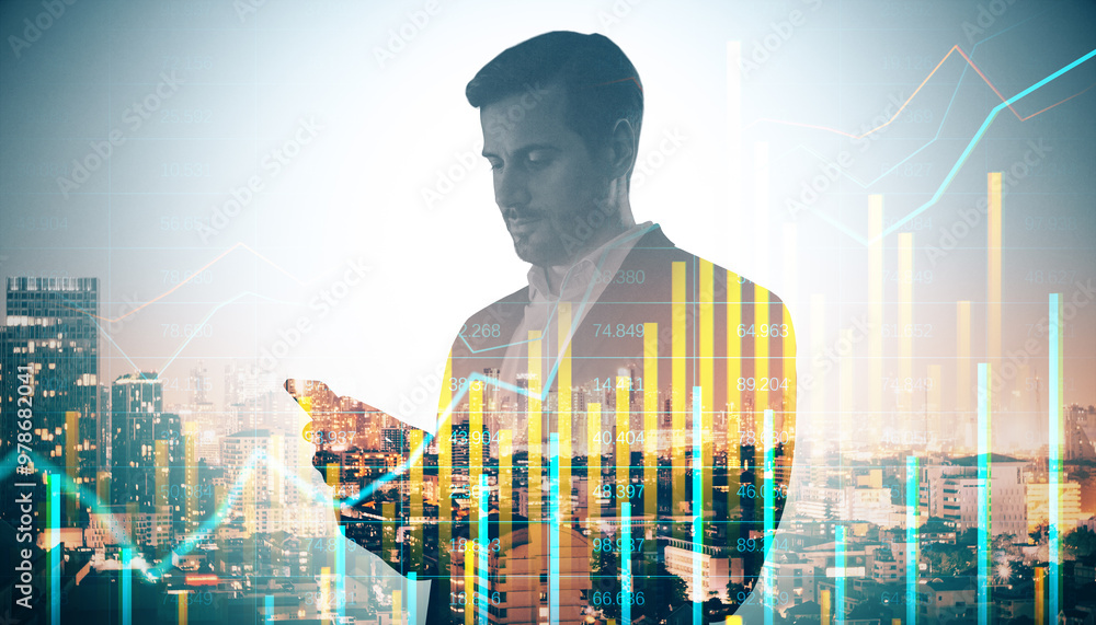 Canvas Prints Portrait of attractive young european businessman with tablet on dawn city background with forex chart and mock up place. Success, financial market growth and future concept. Double exposure.