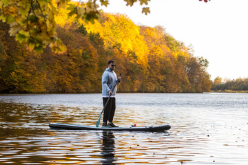 Paddleboarding in Autumn Serenity