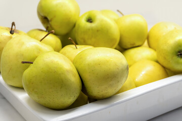 Ripe Apples on a White Tray - Side View