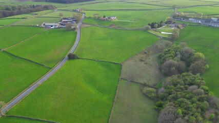 High Angle View of British Agricultural Farms at Countryside and Beautiful Landscape of Near Hills of Rotherham, England Great Britain of UK. April 30th, 2024
