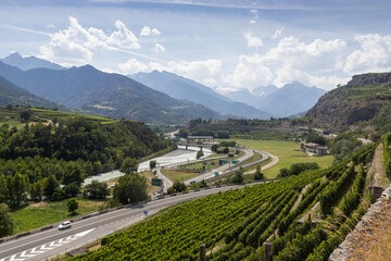 View of the Aosta Valley and Dora Baltea River from Sarre near Aosta in Italy. The valley is a major transport route, and connects Italy with the Mont Blanc tunnel and France.