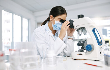 Woman, scientist and microscope for dna in laboratory, sample bacteria and research for vaccine. Female person, biology doctor and equipment for development, studying rna and experiment for cure