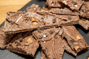 A delicious display of home made chocolate slabs drizzled with salted caramel and topped with biscuit pieces