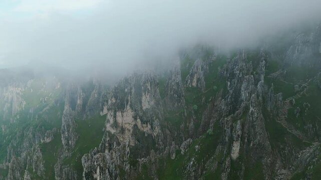 A Picturesque View of the Grignetta Peaks Enveloped in Fog in Lombardy, Italy - Aerial Drone Shot