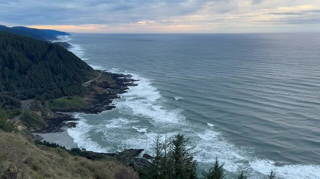 Sea Waves At Sunset Over Oregon Coast's Rocky Beach In The United States. Aerial Wide Shot