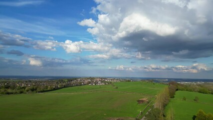 High Angle View of British Agricultural Farms at Countryside and Beautiful Landscape of Near Hills of Rotherham, England Great Britain of UK. April 30th, 2024
