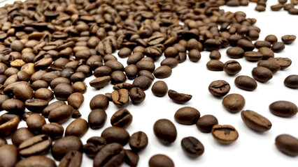 Natural roasted coffee beans on a white background.
