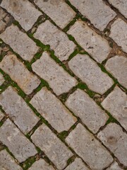 Traditional street paving with small cobblestones in Portugal