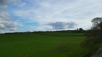 High Angle View of British Agricultural Farms at Countryside and Beautiful Landscape of Near Hills of Rotherham, England Great Britain of UK. April 30th, 2024