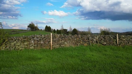 High Angle View of British Agricultural Farms at Countryside and Beautiful Landscape of Near Hills of Rotherham, England Great Britain of UK. April 30th, 2024