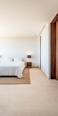Modern bedroom interior with minimalistic design and neutral tones in a spacious, bright setting