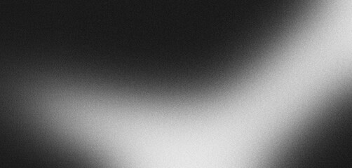 Abstract background with grainy texture and a diagonal light beam transitioning from black to white