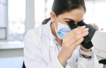 Woman, scientist and microscope for particle in laboratory, sample bacteria and research for vaccine. Female person, biology doctor and equipment for development, studying rna and experiment for cure