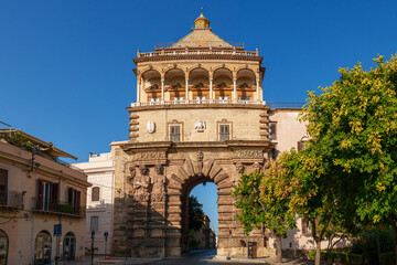 Front view of Porta Nuova in Palermo, Sicily, historic city gate with intricate sculptures and...