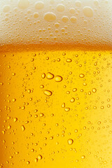 Beer texture. Close-up of beer with foam on top