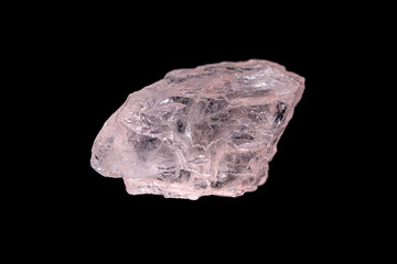 Closeup natural rough Morganite (rose beryl) gemstone on dark background. 