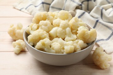 Tasty cooked cauliflower on white wooden table, closeup