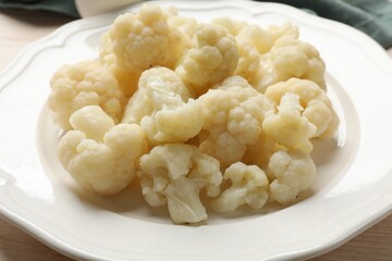 Plate with tasty cooked cauliflower on table, closeup