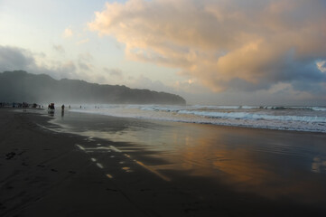 Yogyakarta, Indonesia, September 15, 2024. Parangtritis Beach, Yogyakarta, is visited by local and foreign tourists during the long holiday.