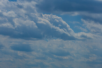 Blue sky and white and gray clouds. Texture background for design.