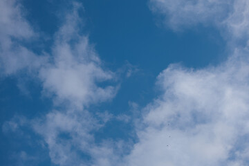Blue sky and white and gray clouds. Texture background for design.