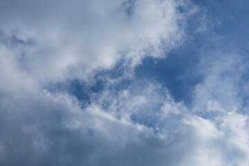 Blue sky and white and gray clouds. Texture background for design.